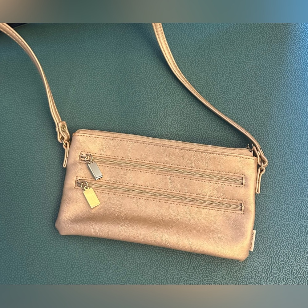 EUC taupe / golden color lightweight night out or travel bag. Cross body fit .
